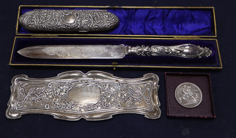 An Edwardian Art Nouveau repousse silver pin tray, William Neale, Chester, 1902, 21.9cm & 3 other items.